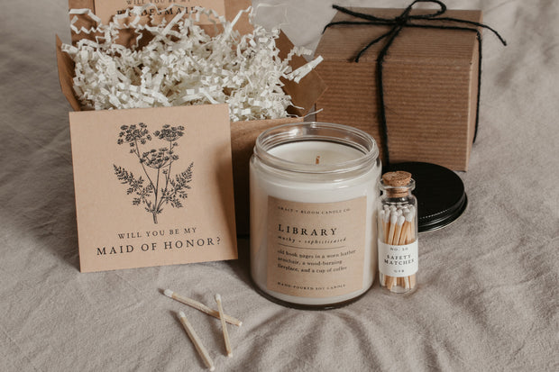 Surprise your bridesmaids with a thoughtful and aesthetic dark academia-themed bridesmaid proposal gift box! They'll be all ready for a cozy evening of reading with this gorgeous set from Grace and Bloom Co!
