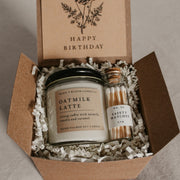 Give the gift of coziness with a boxed birthday gift from Grace and Bloom Co! It includes a small candle in a literary book inspired scent and a glass cork-topped bottle of matches. A card that says Happy Birthday in a vintage botanical style is attached to the inside cover of the box. It can be removed and used as a bookmark.