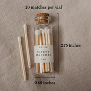 Our pretty glass bottles with cork lids come in the dark academia gift box with 20 safety matches. This picture shows their measurement of 2.75" x .86".