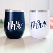 A great gift for bridesmaid proposals or baby shower gifts, your choice of a matte black or matte white insulated wine tumbler with personalized writing on the front: a name or short phrase will be hand-lettered by our lettering artist and applied to the mug in foil vinyl letters.